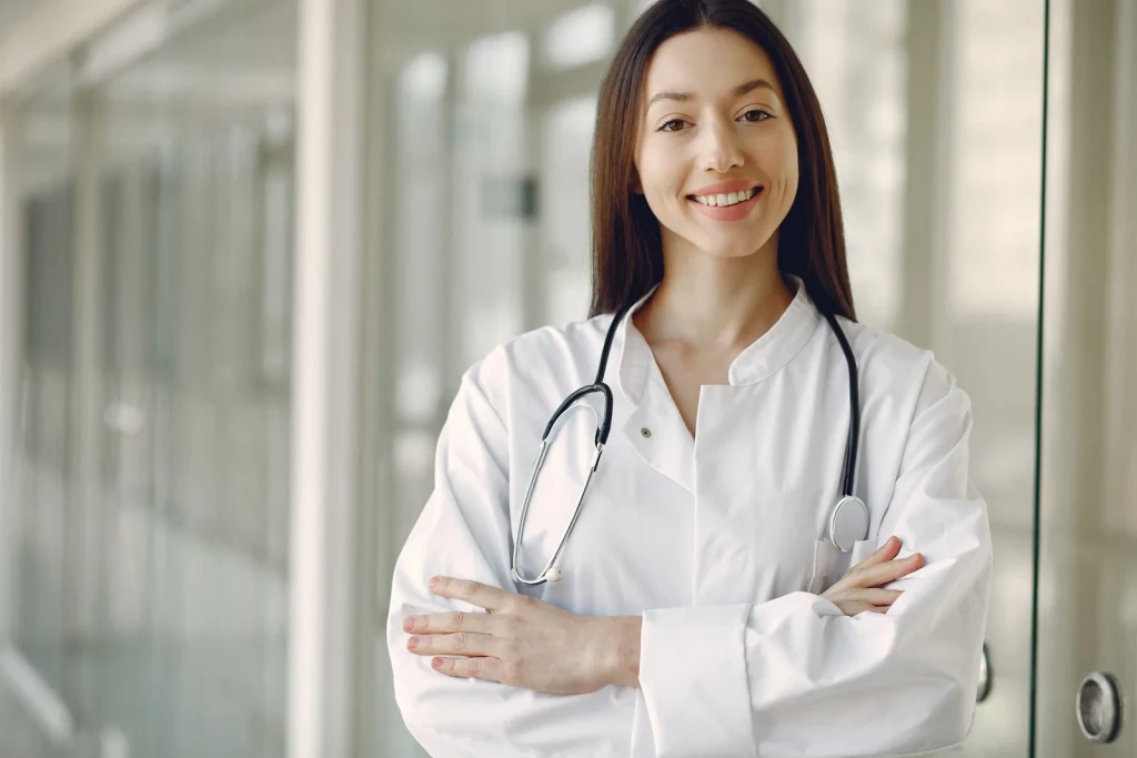 Doctor in medical uniform with a stethoscope in a London clinic