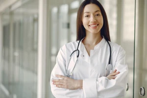 Doctor in medical uniform with a stethoscope in a London clinic
