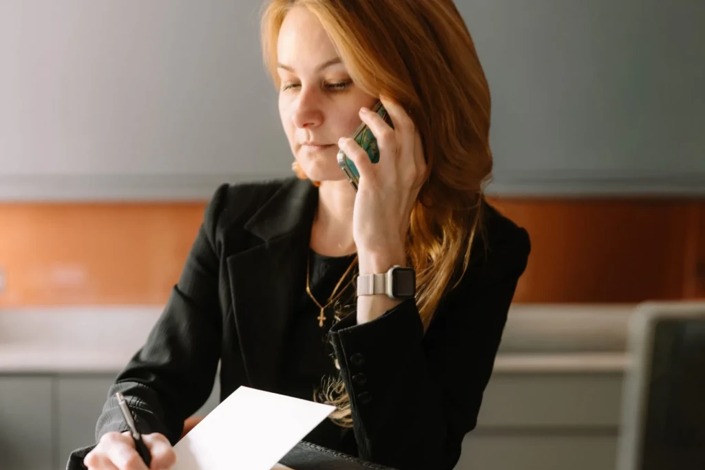 Business owner at a desk arranging a courier booking in London