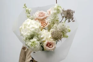 Courier handling fragile floral arrangements with care