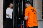 Selena courier collecting from a client at their premises