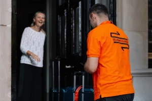 Selena courier collecting from a client at their premises