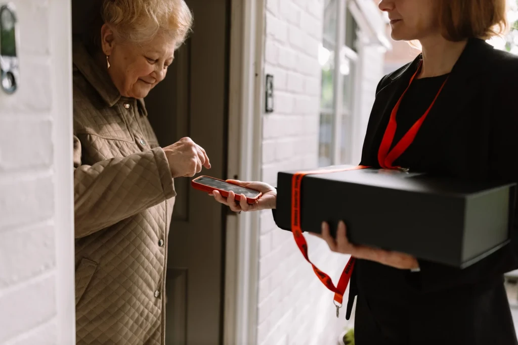 Client receiving a Selena Courier box at her front door