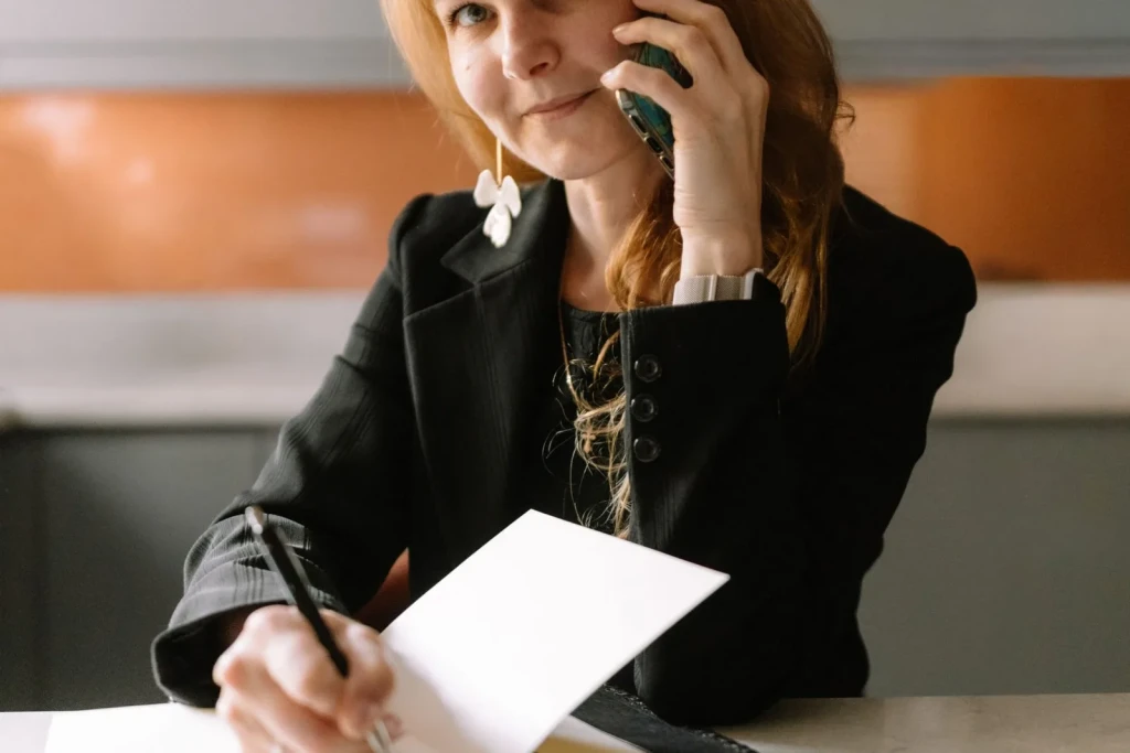 Office desk work: notes, laptop and a same-day delivery request