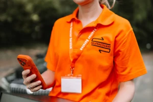 Selena courier with parcel and phone during a same-day round