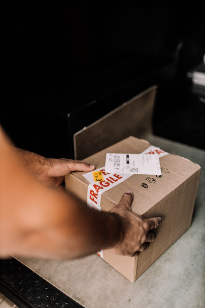 Courier delivering prescriptions to a home