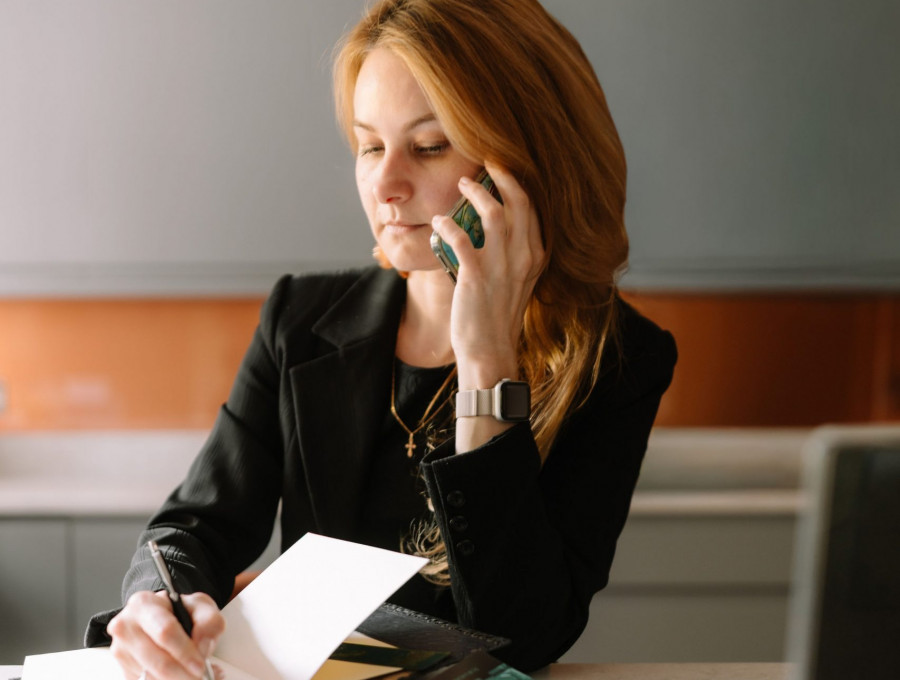 Business owner at a desk arranging a courier booking in London