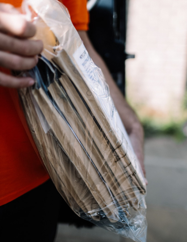 Courier handling bundled items for a scheduled delivery route