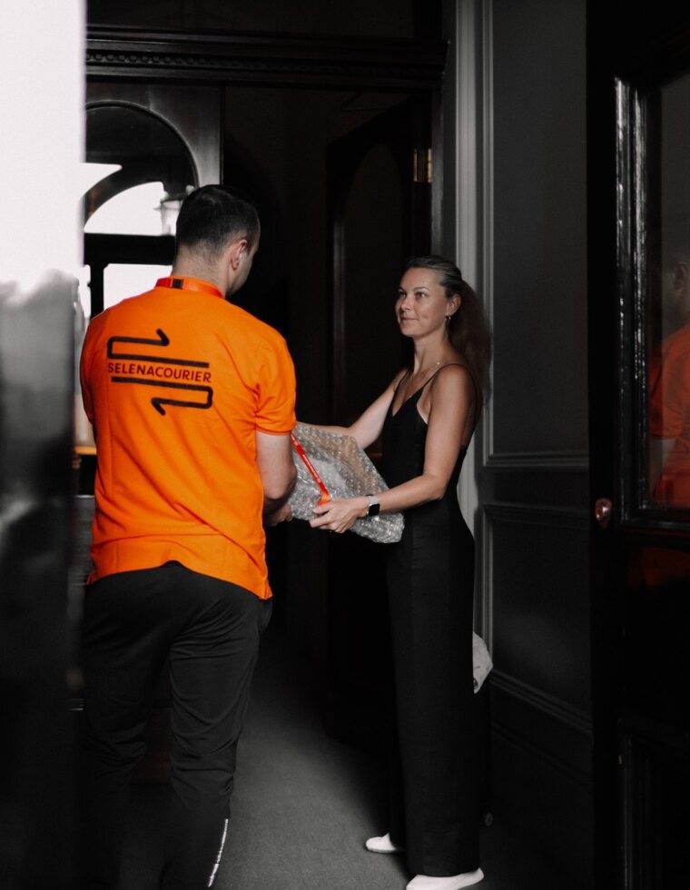 Selena courier completing a careful professional handover